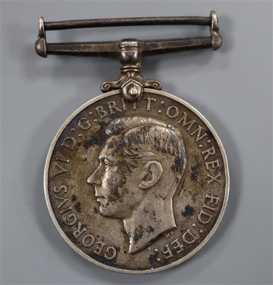 A George VI Royal Naval Reserve Long Service and Good Conduct medal to A J Harper, Ch. Engn